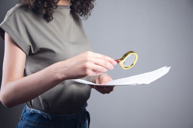 A person holding a document with a magnifying glass over it, focusing on key terms and clauses in the privacy policy.