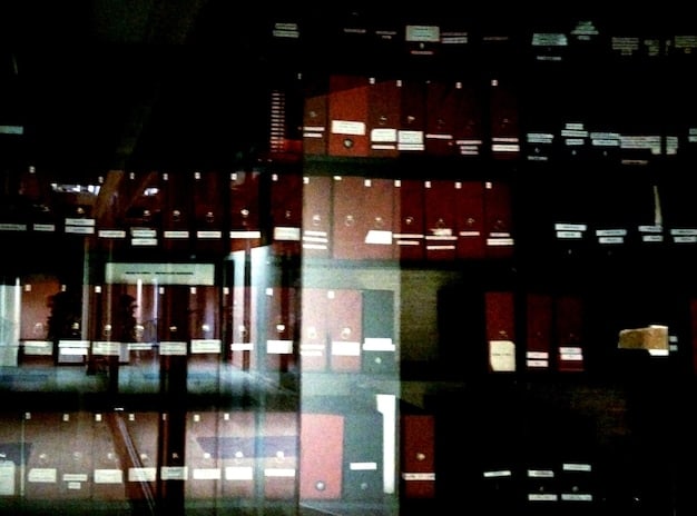 A screenshot of a typical Dark Web marketplace, showing various listings for illegal goods and services, with blurred images and vague descriptions.