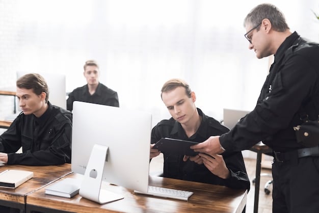A security professional explaining social engineering tactics to a group of employees in an office setting.